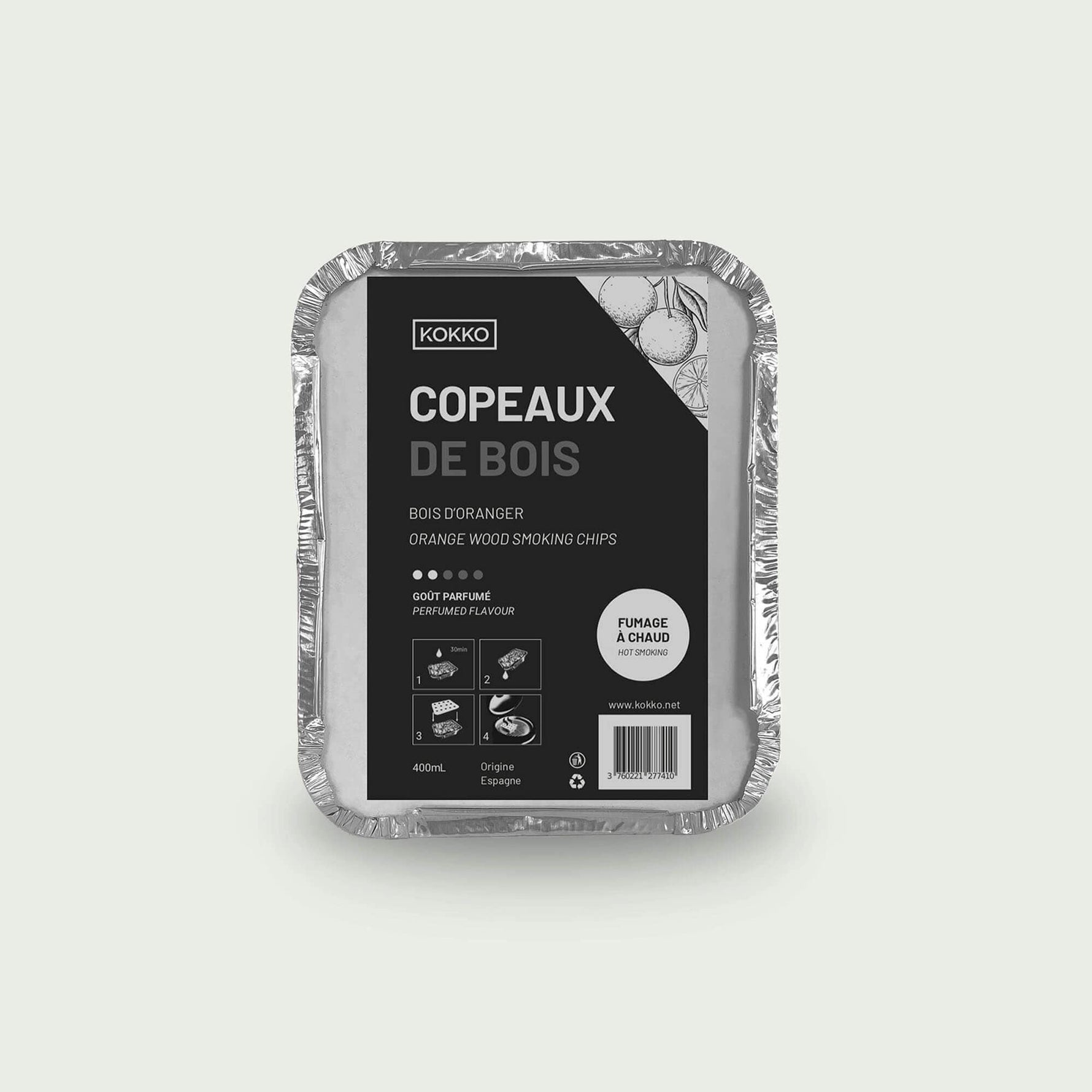 Boîte de copeaux de bois d’oranger Kokko, conçue pour le fumage à chaud et apportant une saveur douce et fruitée aux grillades.