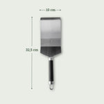 Spatule XL en inox avec manche noir, dimensions 32,5 cm de long et tête de 10 cm de large.