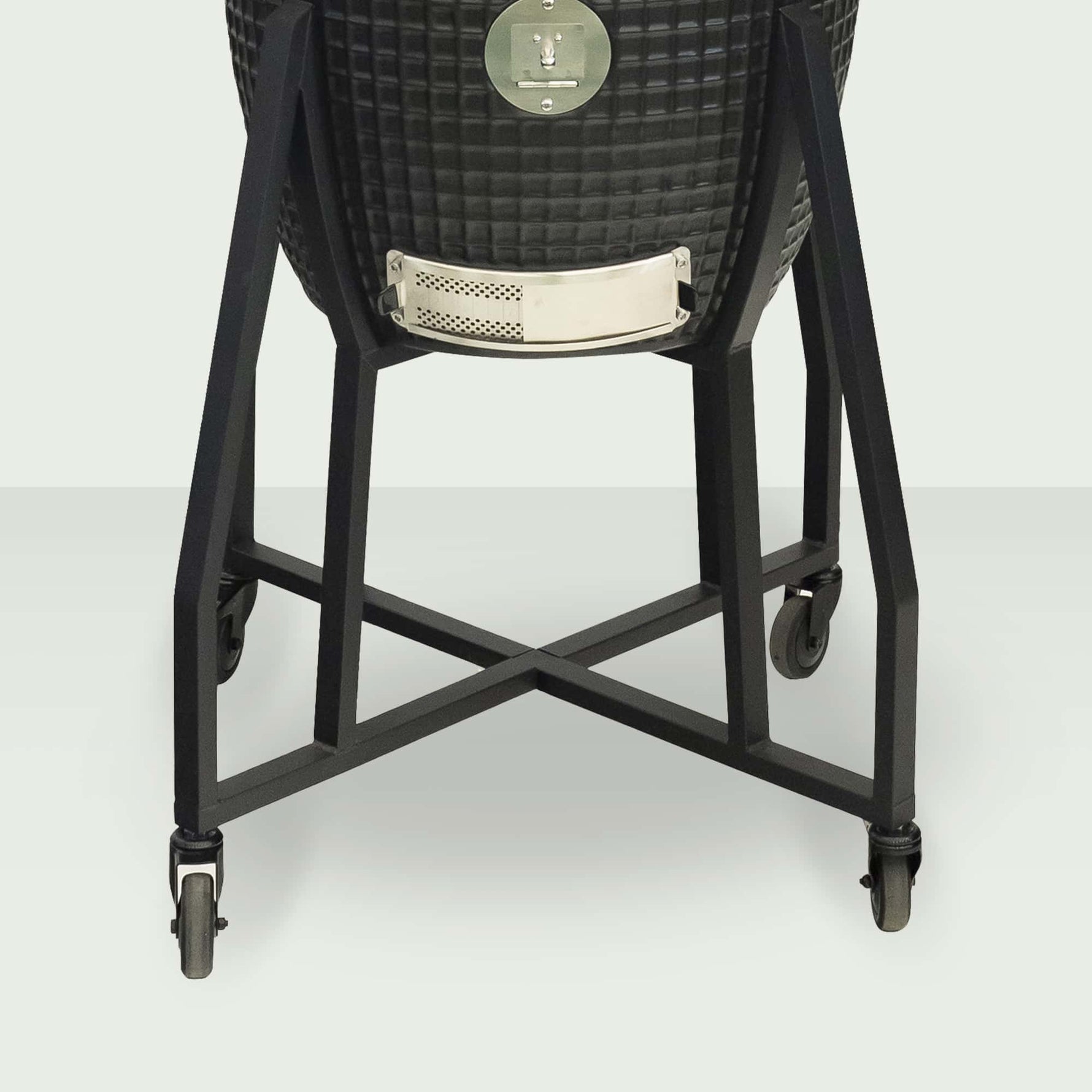 Chariot robuste en acier peint du Kamado Forest Grill, équipé de roulettes pour un déplacement facile.