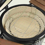 Vue de dessus de l’intérieur d’un barbecue Kamado avec une grille de cuisson en acier inoxydable et des éléments en céramique épaisse pour une cuisson homogène et durable.