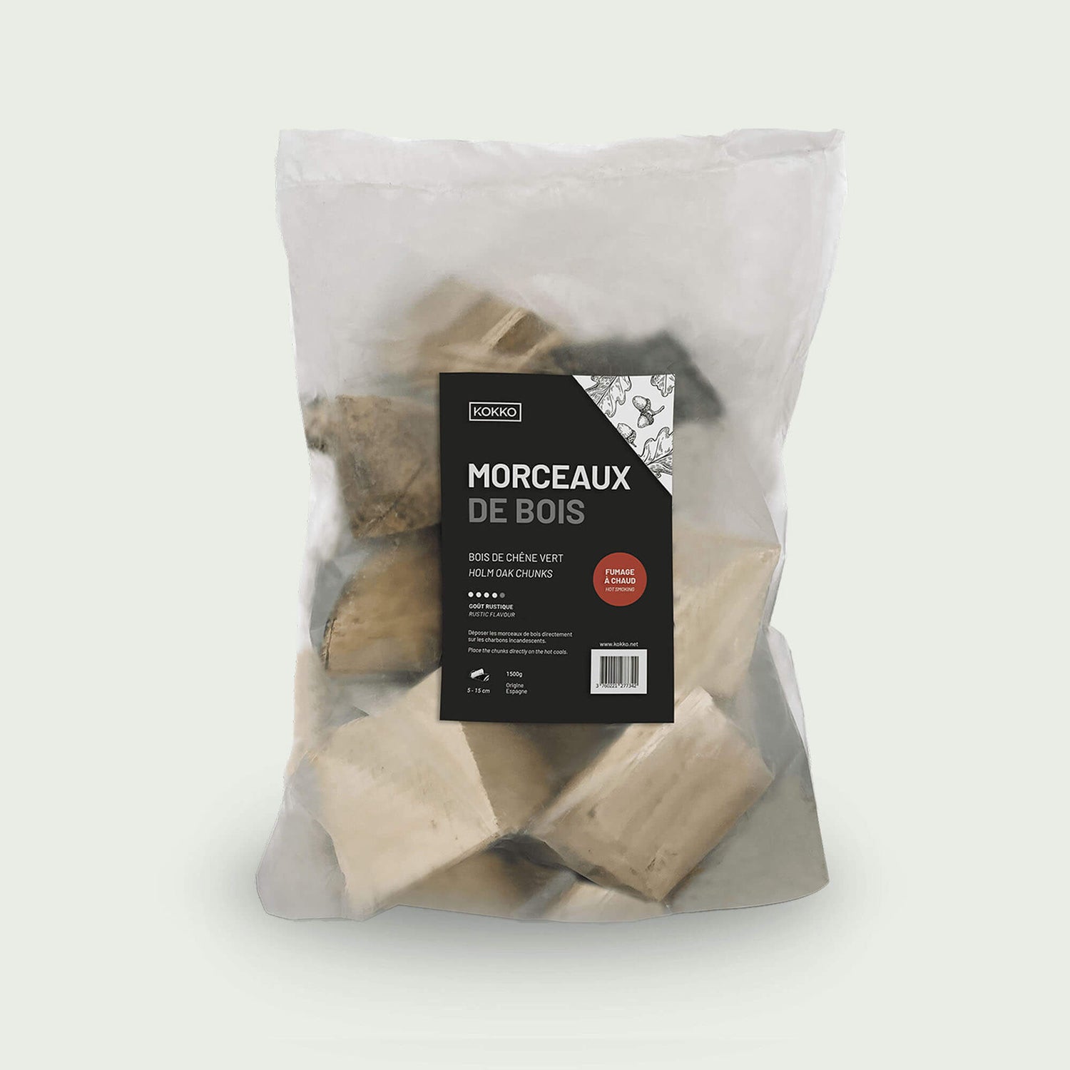 Sac transparent contenant des morceaux de bois de chêne, avec étiquette noire, idéal pour le fumage et la cuisson à chaud au barbecue ou au Kamado.