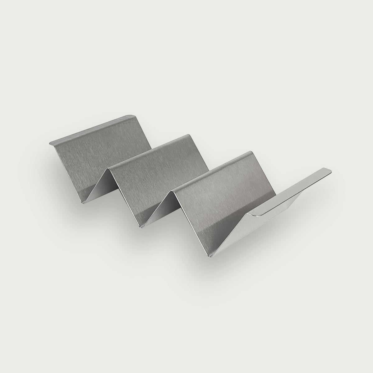 Support à tacos en inox brossé, idéal pour maintenir et garnir facilement plusieurs tacos sans les renverser lors de la préparation ou du service.