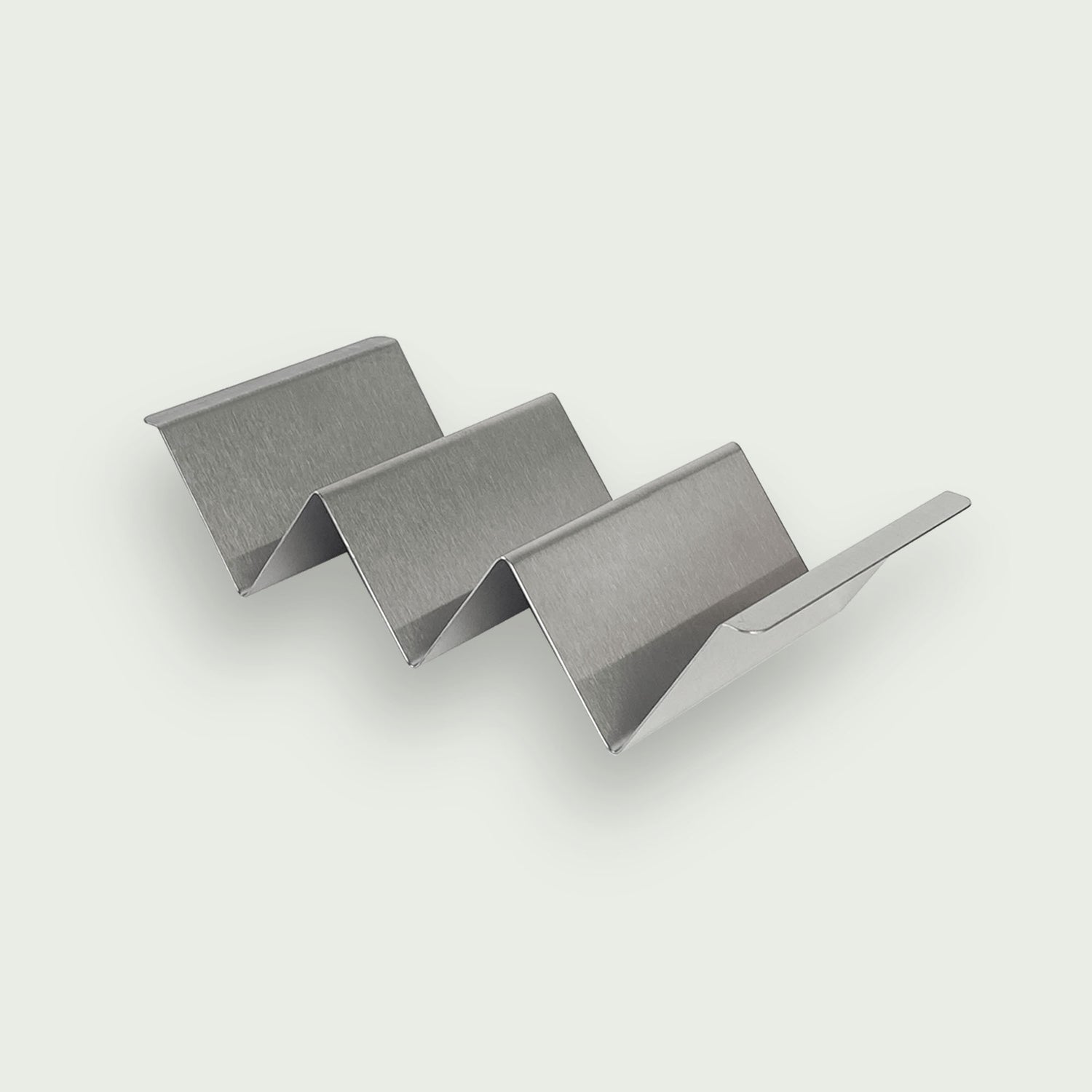 Support à tacos en inox brossé, idéal pour maintenir et garnir facilement plusieurs tacos sans les renverser lors de la préparation ou du service.